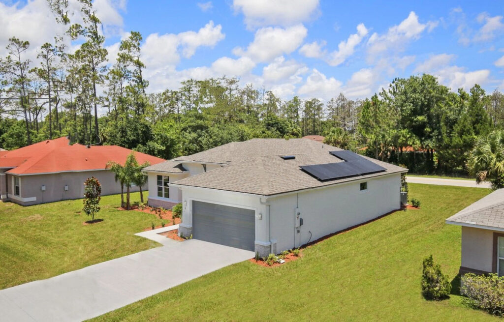 image of single-family home with solar panels