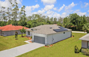 image of single-family home with solar panels